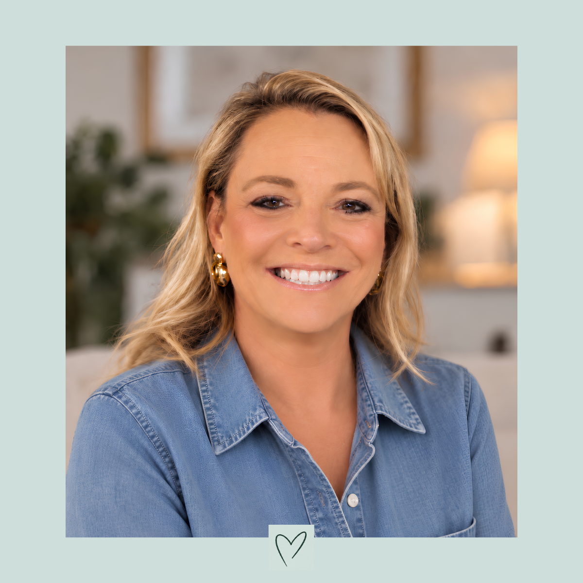 Profile picture of Philippa Ann Jewellery Designer wearing a denim shirt in a living room